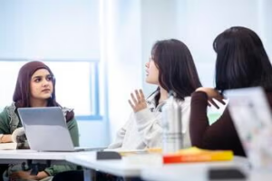 Students discussing ideas in a classroom setting
